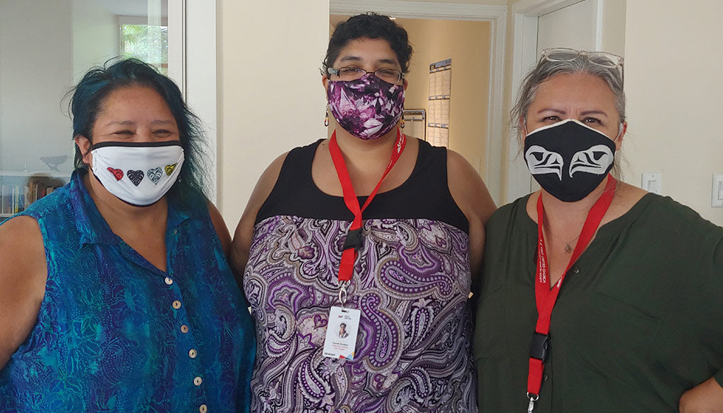 Three people wearing face masks.