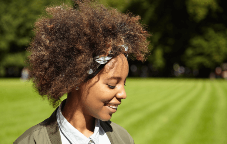 American african woman smiling with headband outdoor
