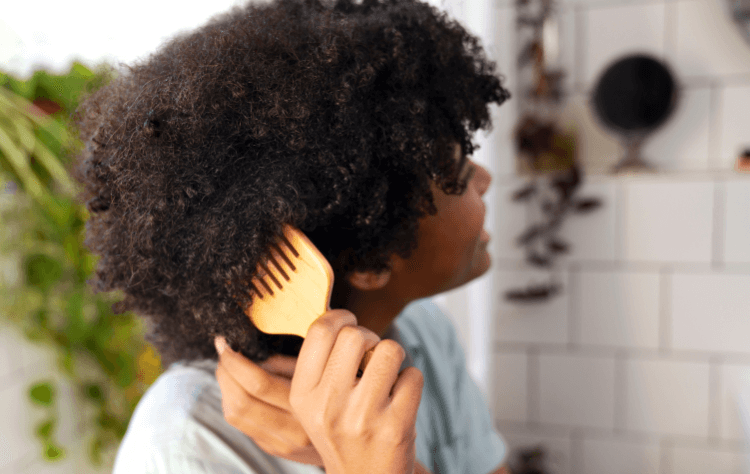 American african woman taking care afro hair