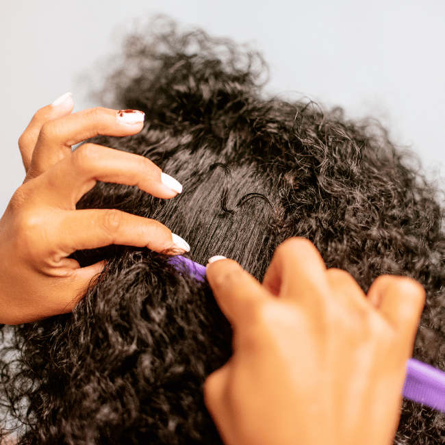 African American Girl Brushing her Hair