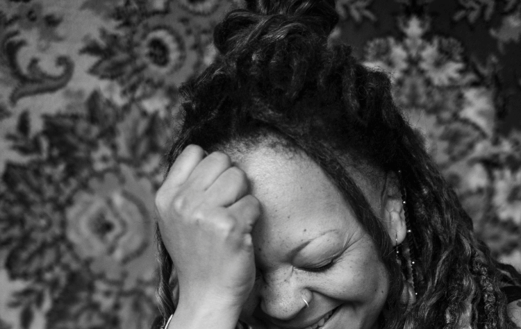 high angle black woman with dreadlock hair posing