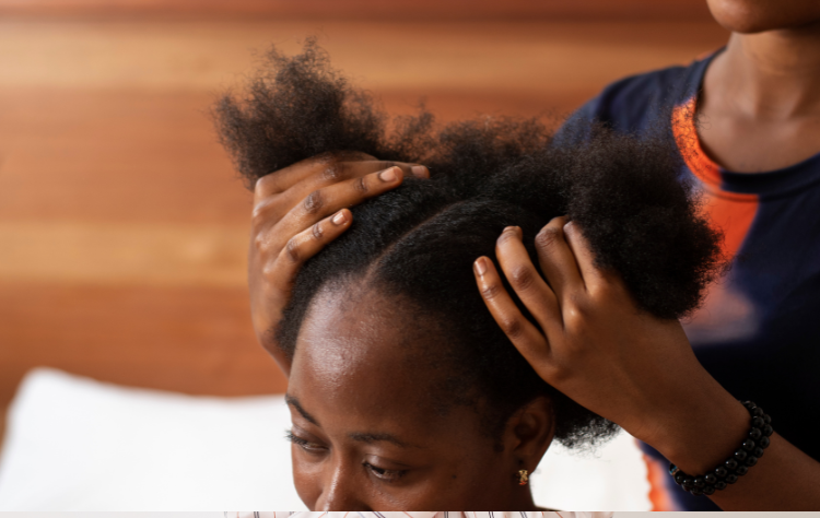 stylist black woman taking care her client afro hair