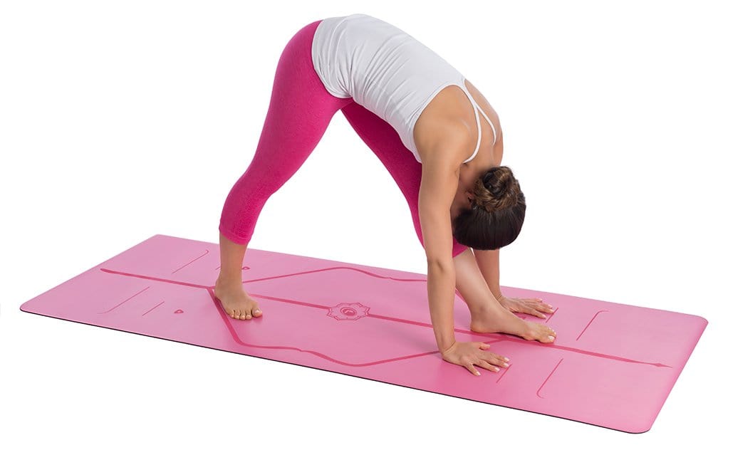 Female Yogi in Tree Pose on a Liforme Yoga Mat - Pink