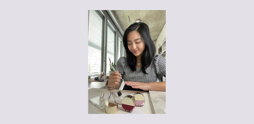 Photo of nail artist and content creator Emily Zheng painting her nails with Emilie Heathe Nail Artist Nail Polishes.