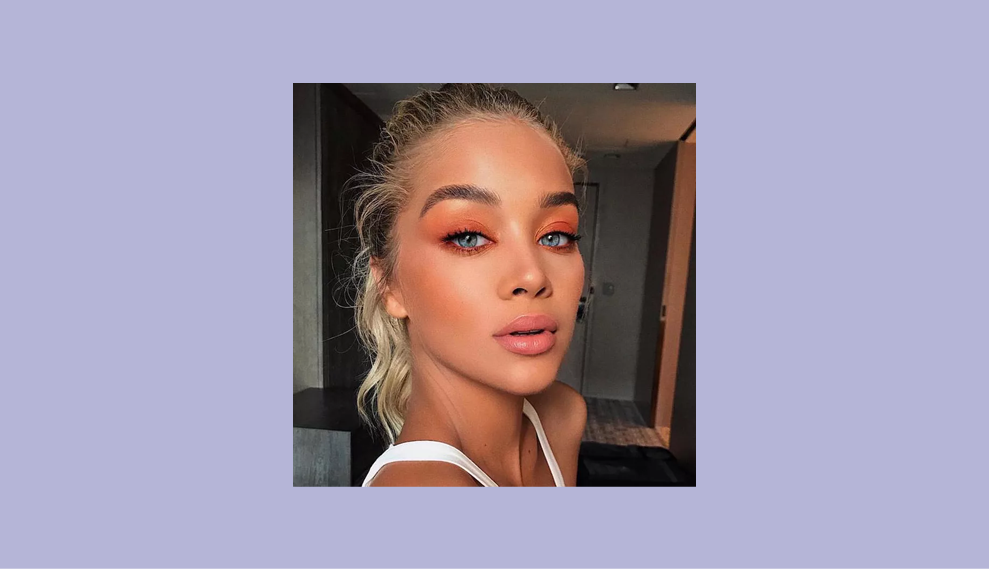 @GoldenBarbie on Instagram wearing orange eyeshadow