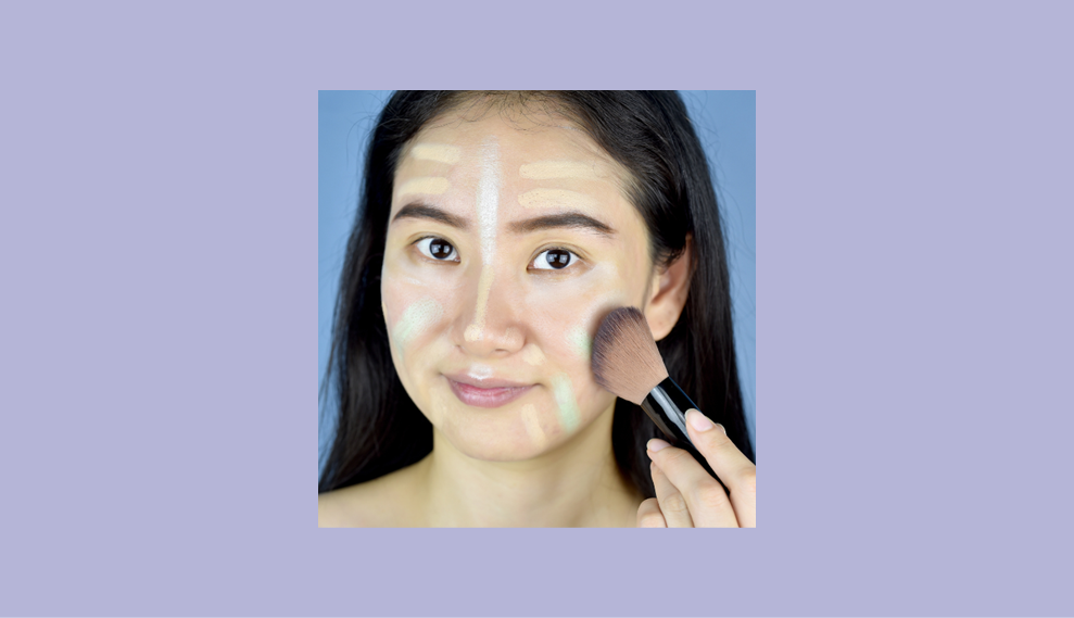 A woman apply color correcting concealer