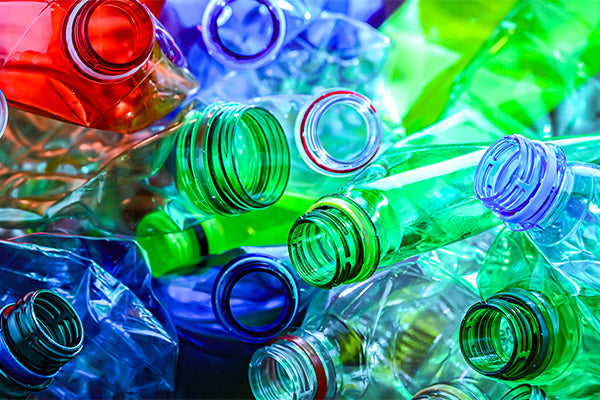 Colorful image of multiple single-use plastic bottles.