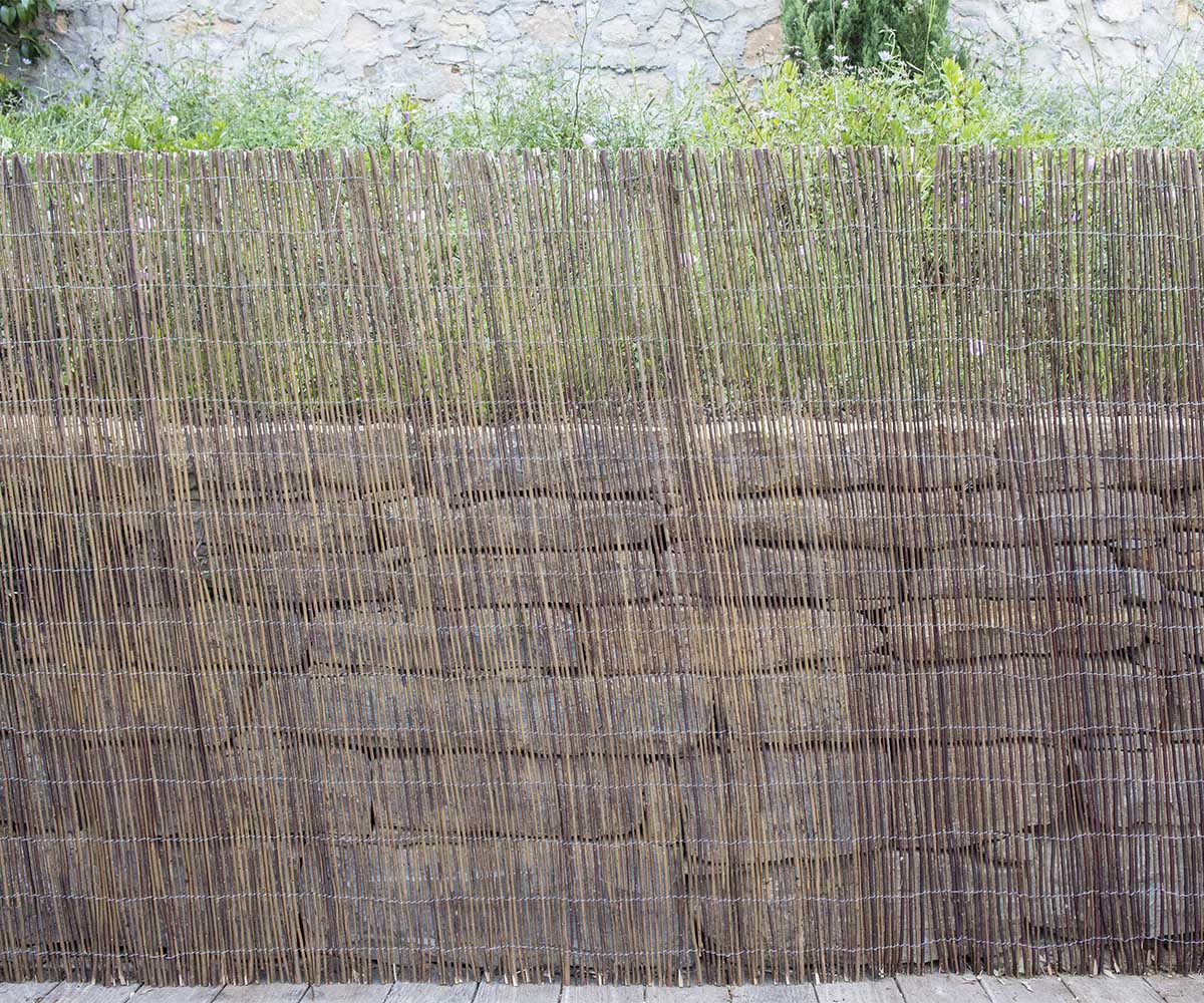 natural wicker privacy screen in a garden