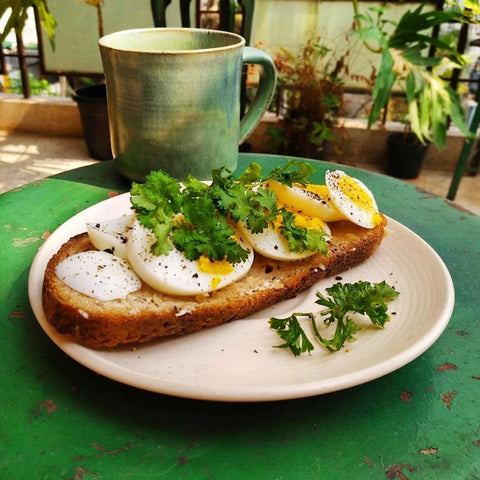 Boiled egg and parsley on toast