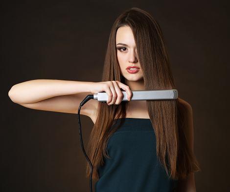 hair extensions and a straightener