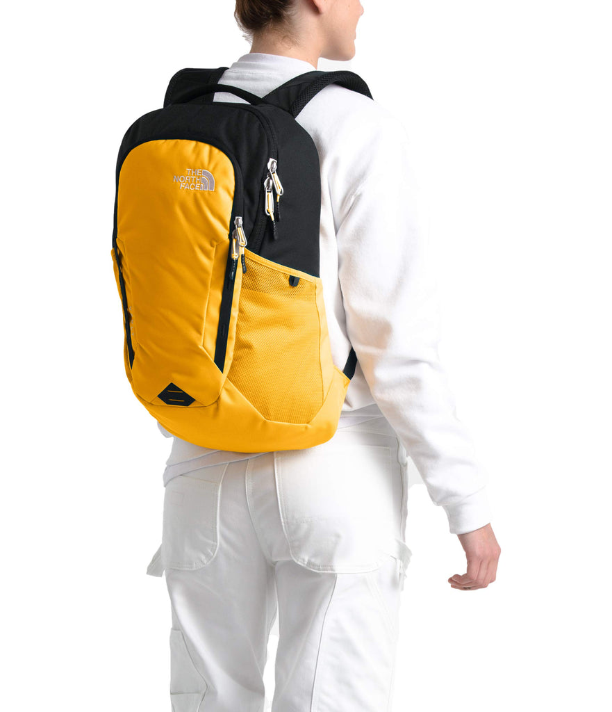yellow and black north face backpack