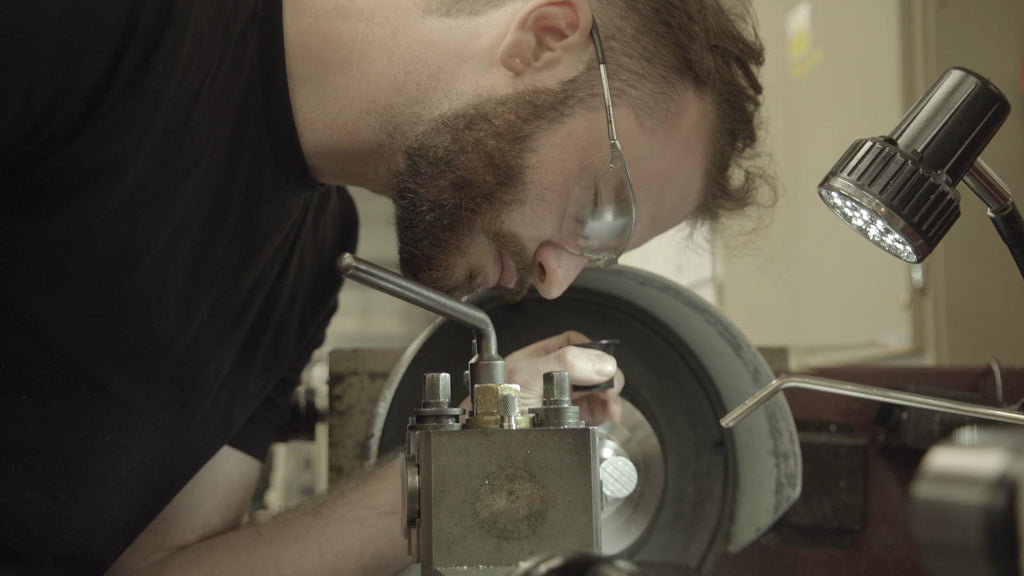 Machinist using manual lathe to make 3D printer HotEnd prototypes