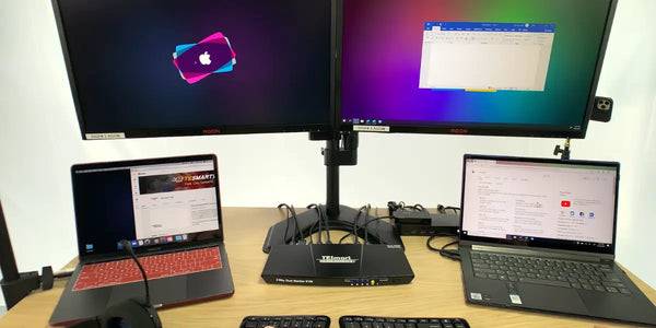 Dual monitor KVM switch setup with two laptops connected to dual monitors for hybrid work.