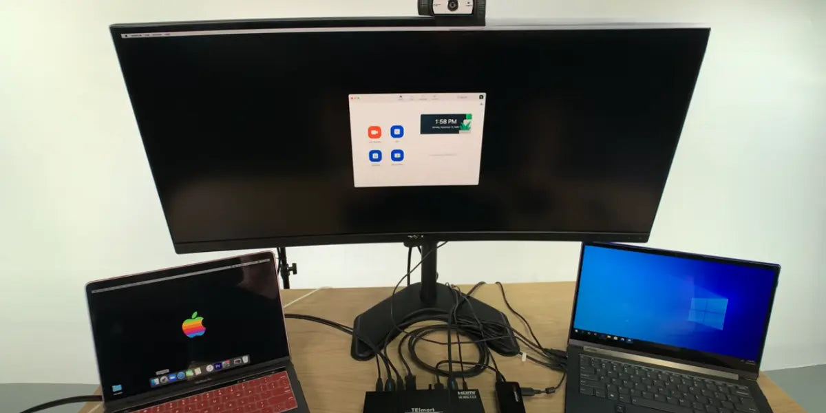KVM switch setup with 2 computers connected to 1 monitor, sharing webcam and Zoom across MacBook and Windows laptop.
