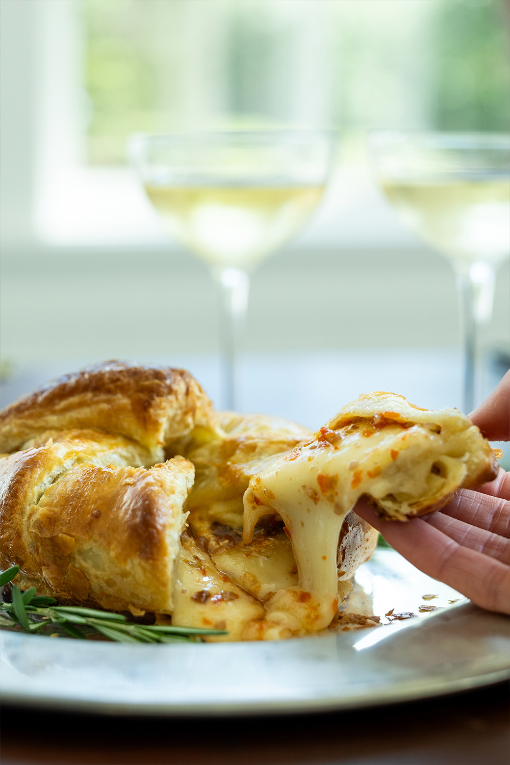 Brie en croute with pecan pepper jelly and 2 glasses of wine