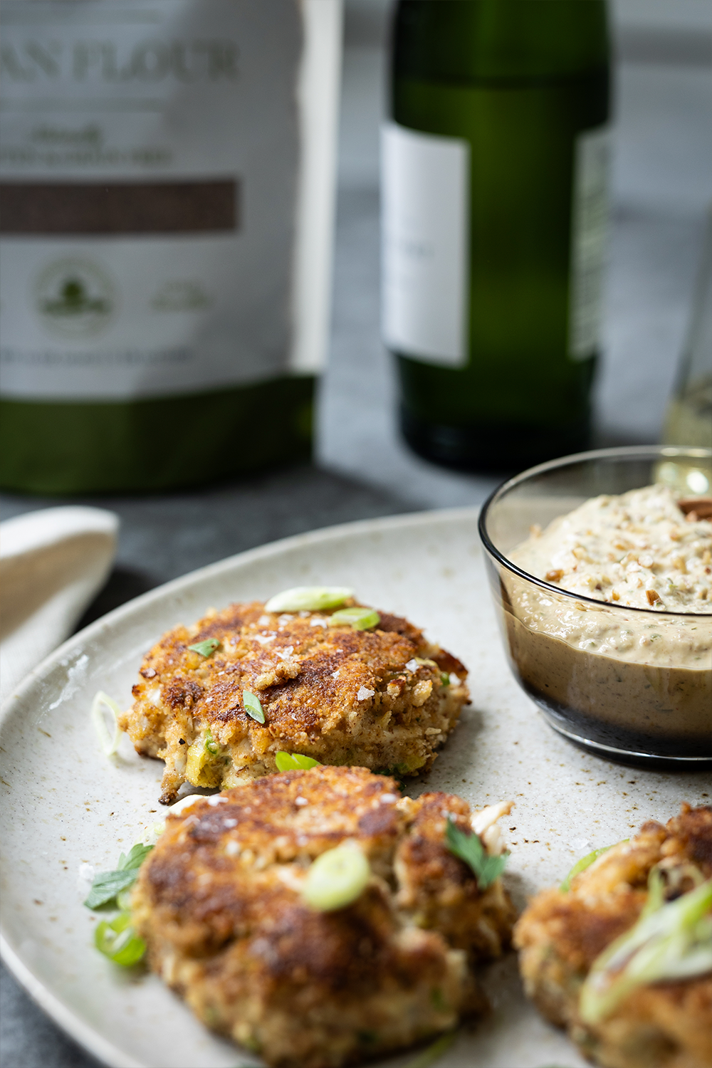 Crab cakes with bag of pecan flour in background