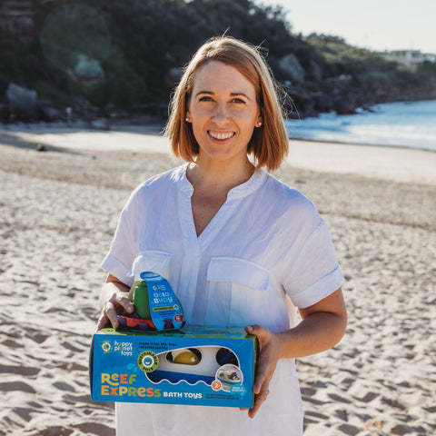 Founder, Miranda, holding Australian Made toys