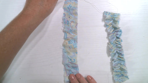 a single row of stitching down the center of a strip of fabric