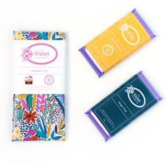 Image of seasonally wrapped chocolate bars from international award-winning chocolatier The Violet Chocolate Company based in Edmonton, Alberta, featuring bars that could be used for trade show favours gifts, promotional business product, car dealership swag, corporate gifting, client appreciation gifts