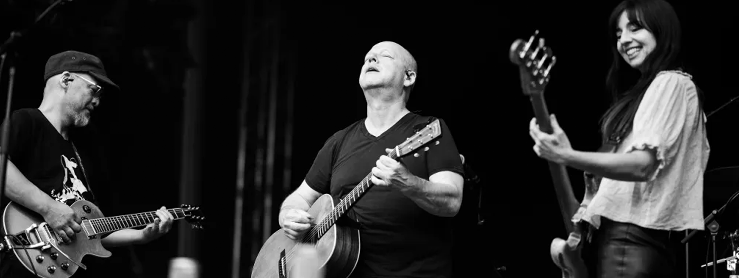 Black and white photo of Pixies performing live