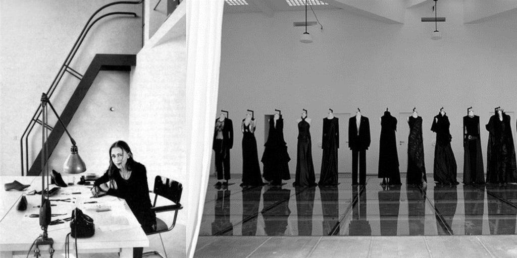 Ann Demeulemeester in her studio sitting at her desk and a picture of Demeulemeester fashion show