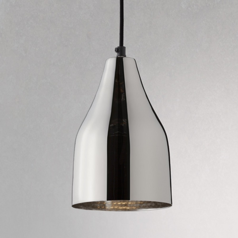 A semi-transparent silver triangular-shaped pendant light with a dimpled brass-coloured interior hanging on a single black cord