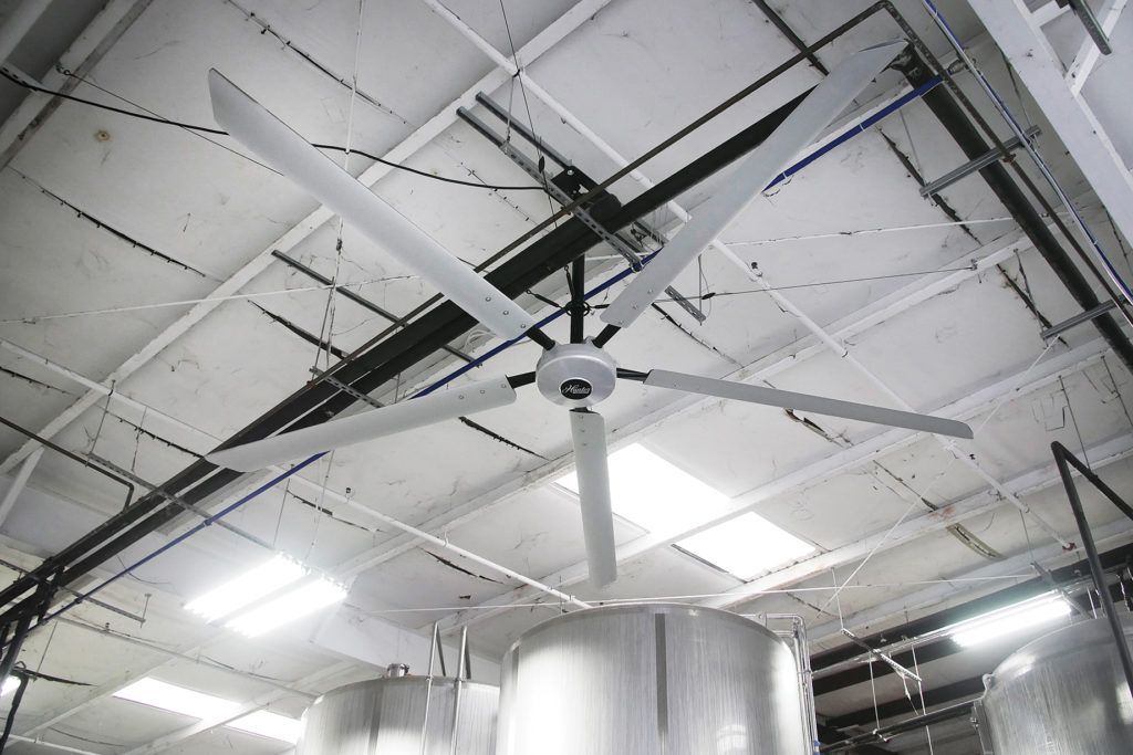 The Titan 16' industrial ceiling fan hangs from the ceiling of the Yazoo Brewery in Nashville.