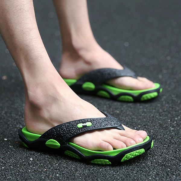 men's feet in flip flops