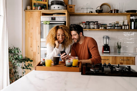 A couple at a table having a snack