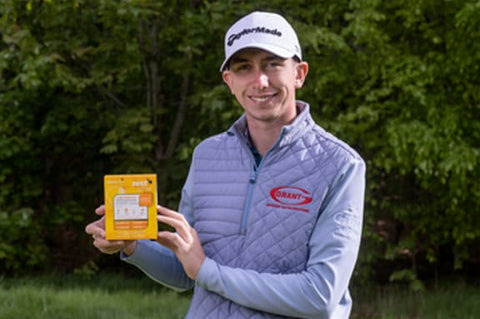 A smiling athlete holding a box of Zest Active 