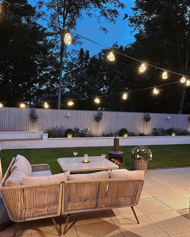 outdoor patio area with lounge sofa and lights 