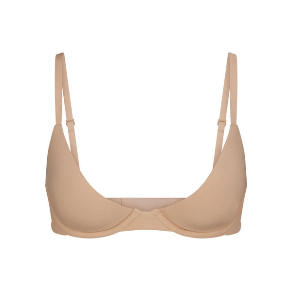 SKIMS - Kim Kardashian West wears the Scoop Neck Bra ($32) and the Dipped  Front Thong ($19) in Clay. Shop the Fits Everybody collection now at SKIMS.COM  and enjoy FREE SHIPPING on