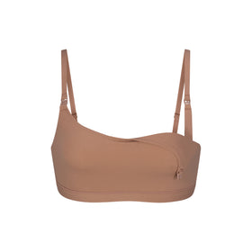 SKIMS - The new Soft Lounge Underwire High Neck Bra: a statement high neck bra  top with ultra-supportive underwire. Available now in 5 colors, including 4  new shades for the season, and