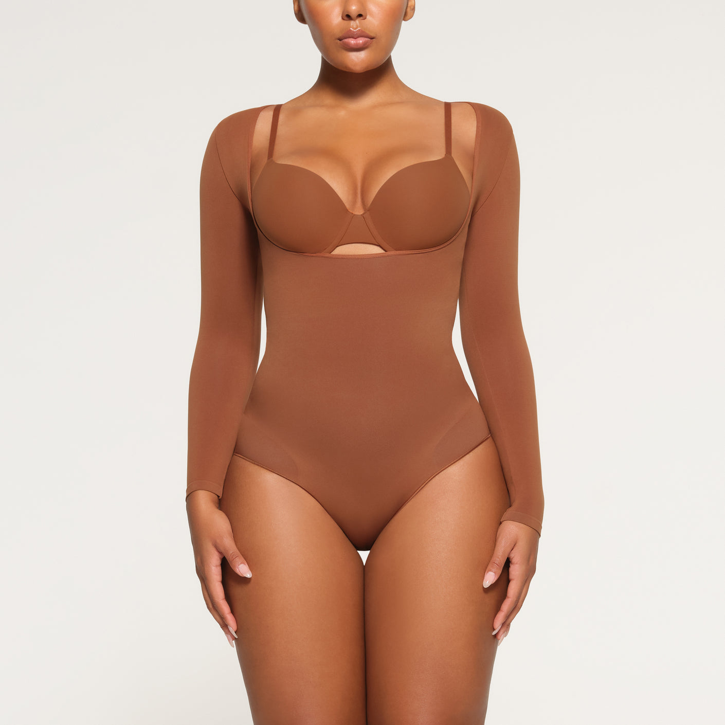 SEAMLESS SCULPT LONG SLEEVE OPEN BUST BRIEF BODYSUIT