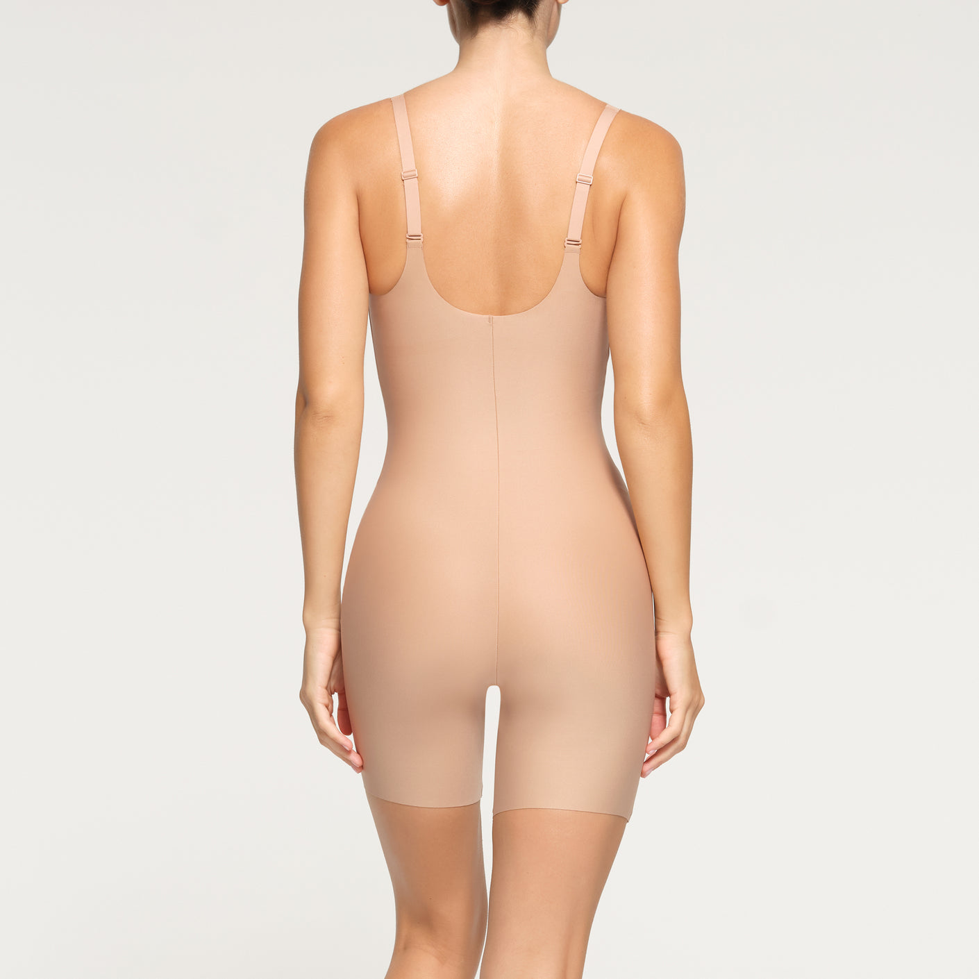SKIMS BODY UNLINED PLUNGE MID THIGH BODYSUIT | CLAY
