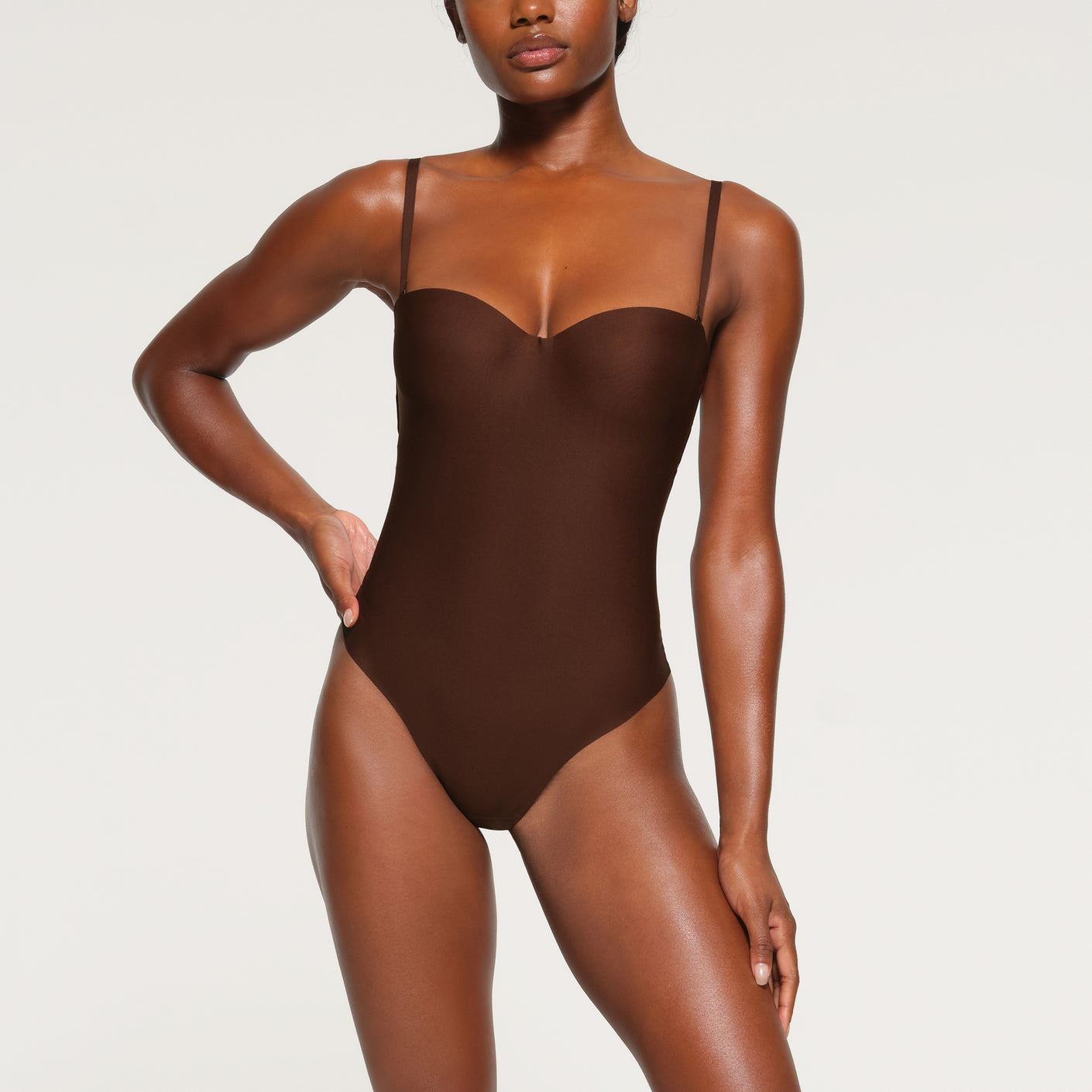 SKIMS BODY UNLINED PLUNGE THONG BODYSUIT | ONYX