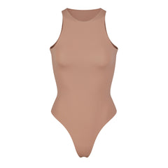 SKIMS on X: SKIMS Stretch Velvet Cut Out Bodysuit — a sexy,  statement-making cut out thong bodysuit made of soft, shiny, and plush  velvet. Launching in Honey, Sienna, Smoke, and Amethyst and