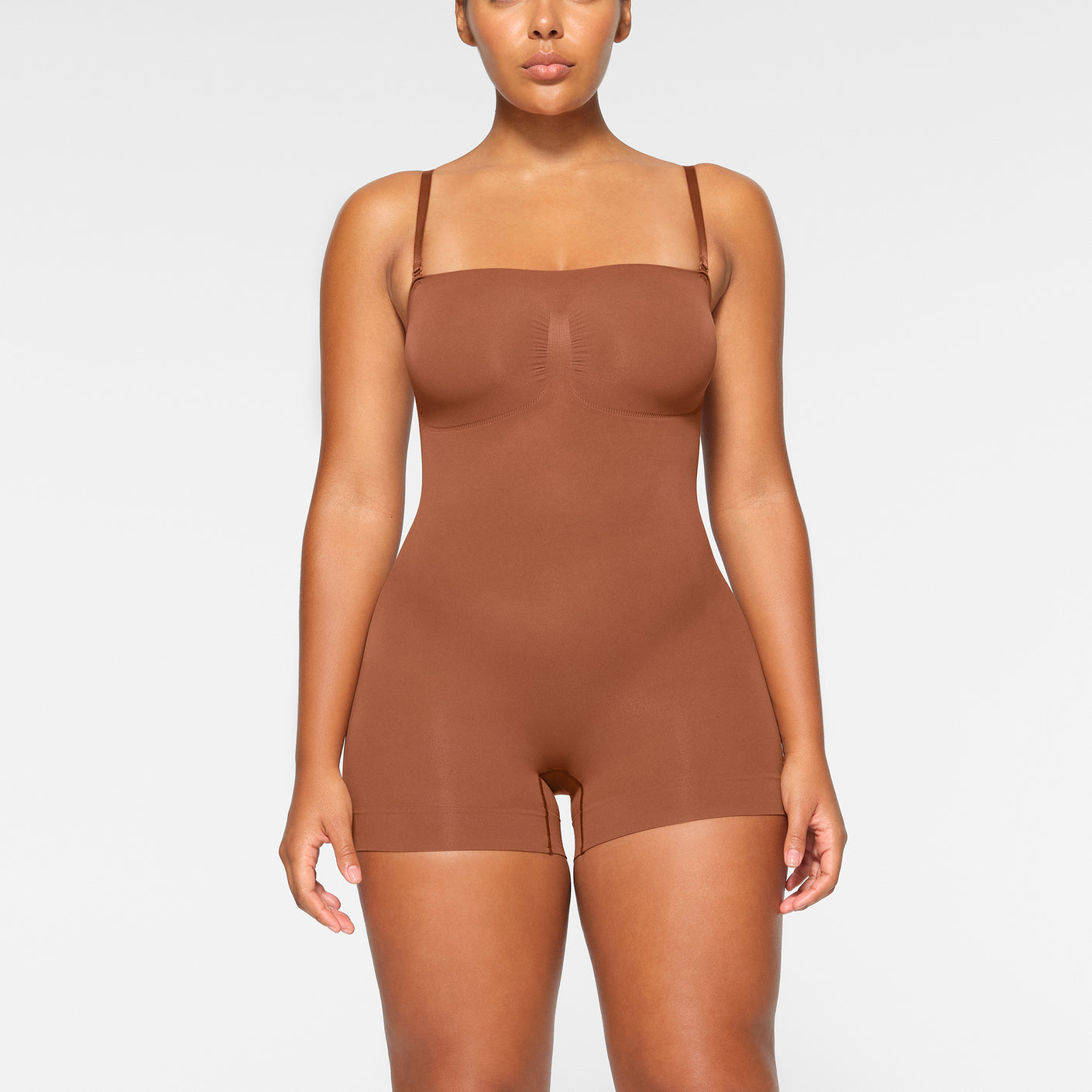 SKIMS - Seamless Sculpt Low Back Mid Thigh Bodysuit in Bronze at