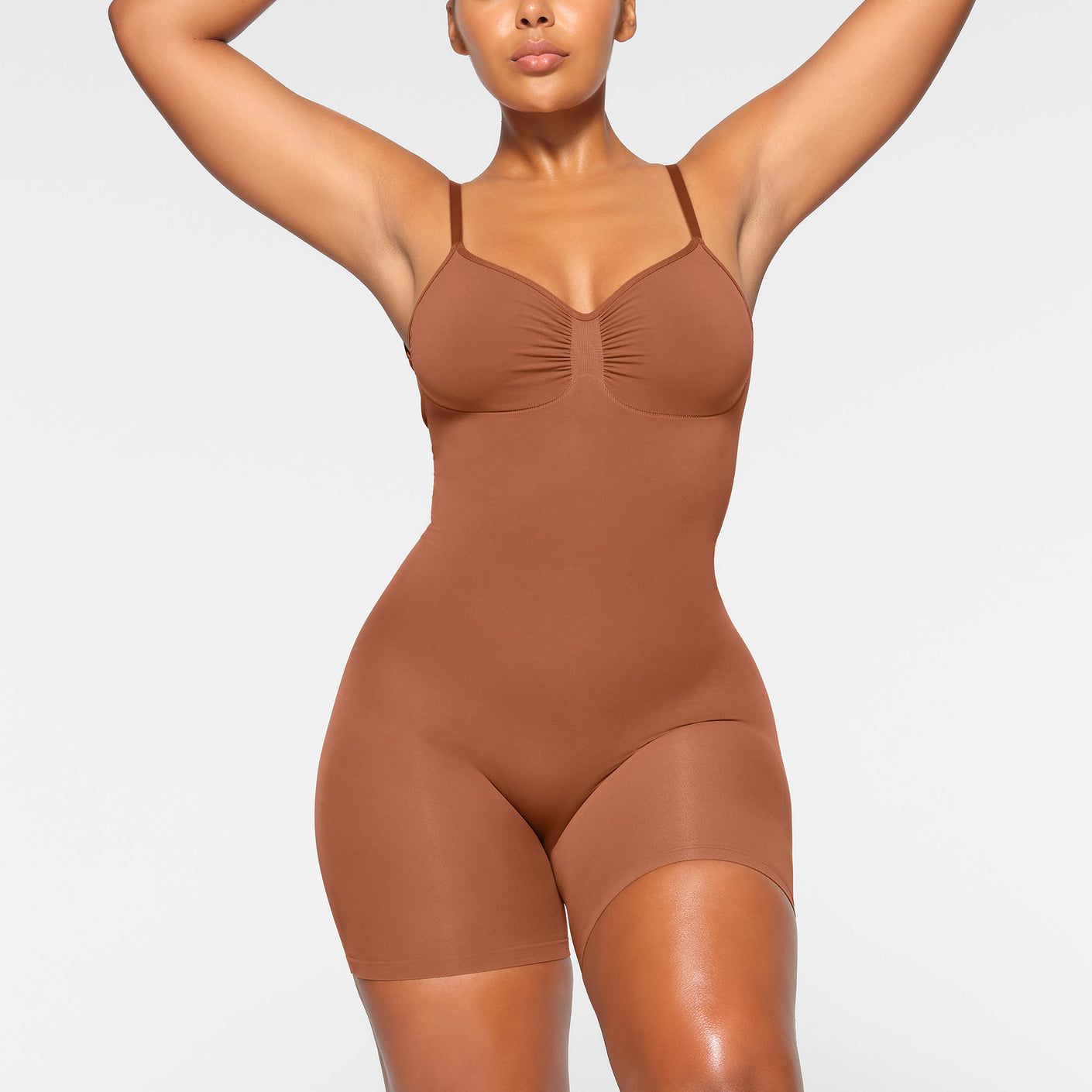 SKIMS on X: The Low Back Mid Thigh Bodysuit — perfect for backless dresses  and tops. Shop Backless shapewear:    / X