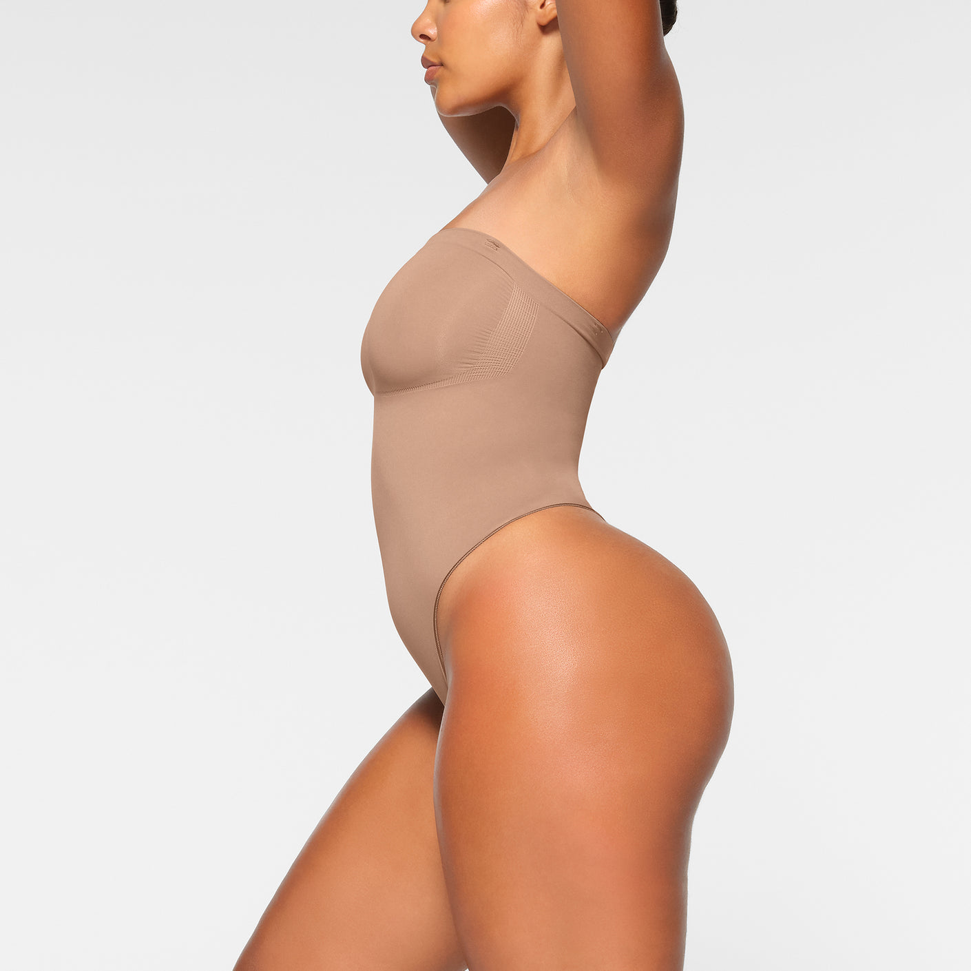 SKIMS - Get a perfectly cinched waist in the new Seamless Sculpt Strapless  Thong Bodysuit, as seen on Raye.