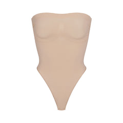 SKIMS - The Core Control Thong ($24) in Sand. Shop now in select sizes and  colors at SKIMS.COM and enjoy free domestic shipping on orders over $75.  Photo: #VanessaBeecroft