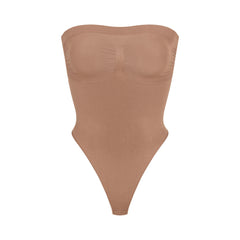 SKIMS on X: SKIMS Stretch Velvet Cut Out Bodysuit — a sexy,  statement-making cut out thong bodysuit made of soft, shiny, and plush  velvet. Launching in Honey, Sienna, Smoke, and Amethyst and