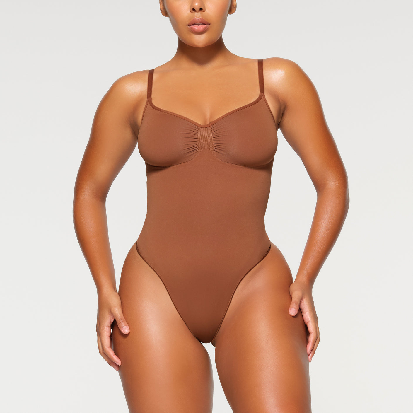 Skims Seamless Sculpt Thong Bodysuit in Brown