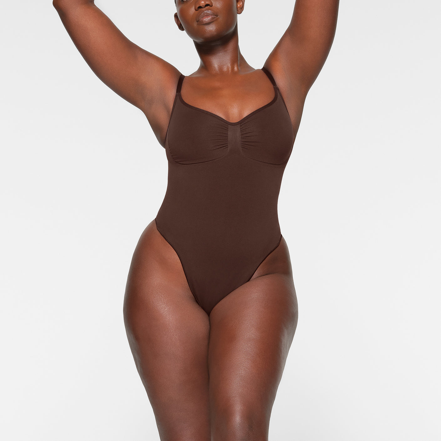 Skims Seamless Sculpt Thong Bodysuit in Brown