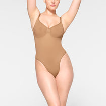 SKIMS Kim Kardashian Wet Look Tank Top Bodysuit Ochre Large NWT