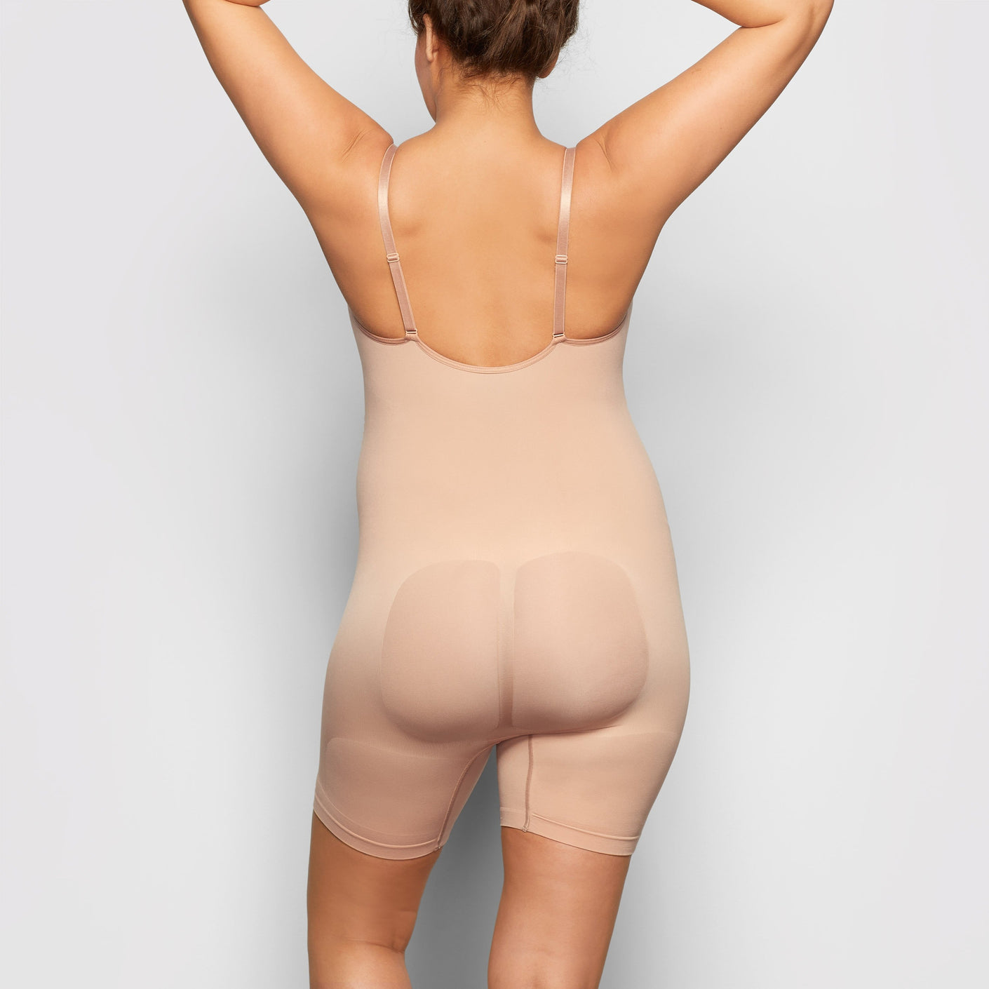 SKIMS on X: Breathable comfort with incredible support, @KimKardashian  wears the Sculpting Bodysuit Mid Thigh in Sienna. Shop now in sizes XXS -  5X:   / X
