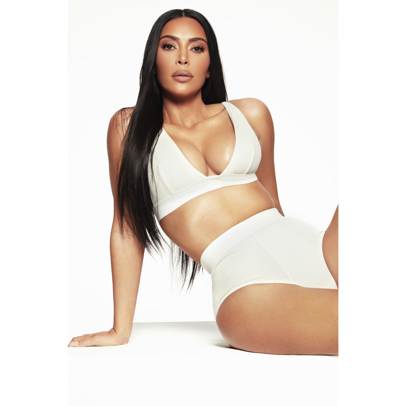 SKIMS - Kim Kardashian West wears the Cotton Rib Tank ($34, available in  select sizes in Bone, Iris Mica, Mineral, and Soot) and the Cotton Rib  Brief ($28, available in select sizes