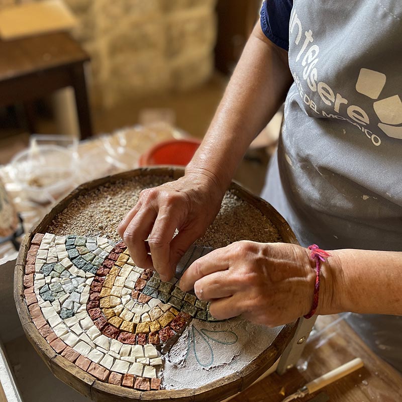 hands making a mosaic with a DIY mosaic kit for adults