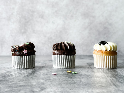 Cupcakes on cement textured background