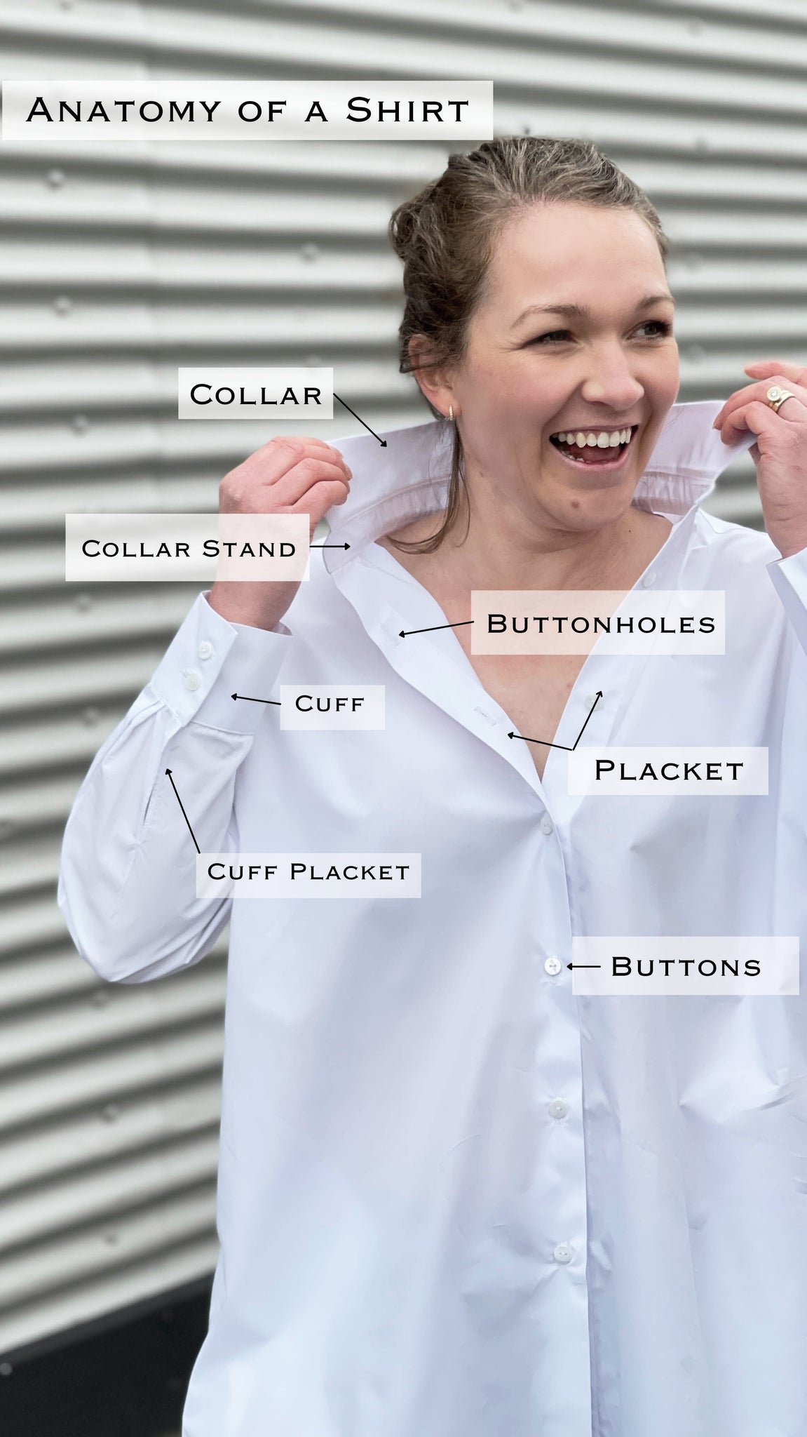 picture of a woman turning the collar of her shirt up. She is looking away from the camera and there are labels all over